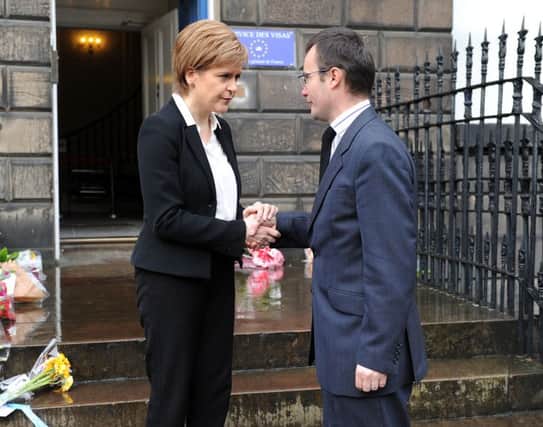First Minister Nicola Sturgeon arrives at the French Consulate and is greeted by French Consulate General Emmanuel Cocher While she is there she also signs the book of condolonses.