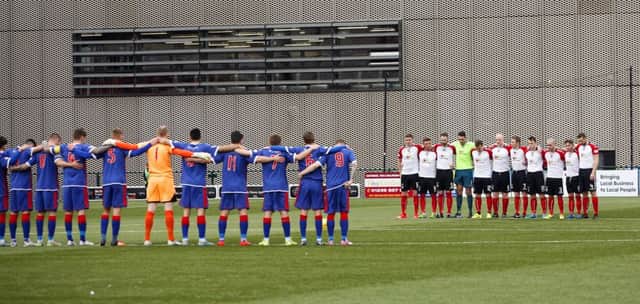 Clyde Football Club Players took part in a minute's silence before their match with Elgin on Saturday