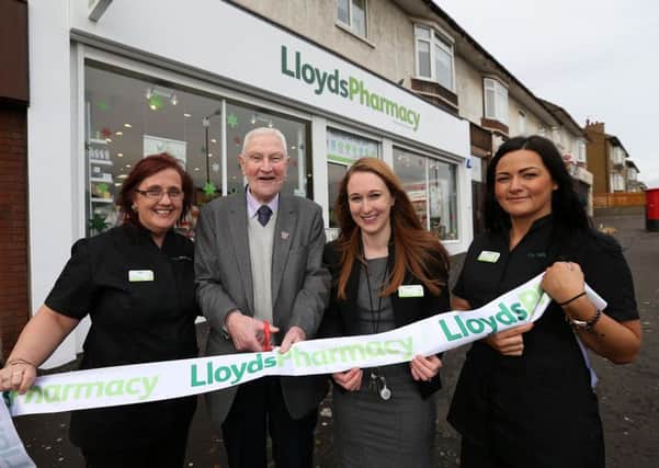 Thomas Spence cutting the ribbon to open new Lloyds store