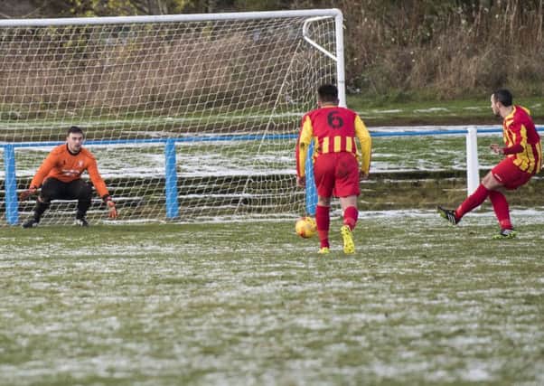 Chris McQuade scores from the penalty spot on Rossvale's win at Lanark