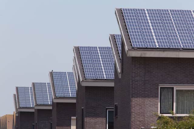 Family homes with solar panels on the roof.