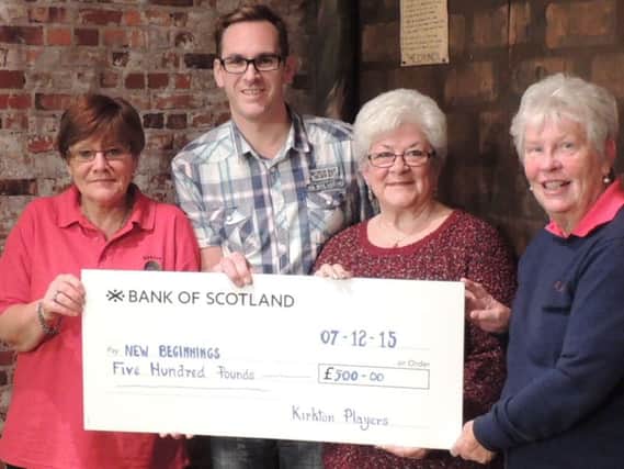 Mary (2nd left) receives the bumper cheque from Kirkton Players' treasurer Moira Barrowman, secretary Mary Tweedie and President George Thomson.