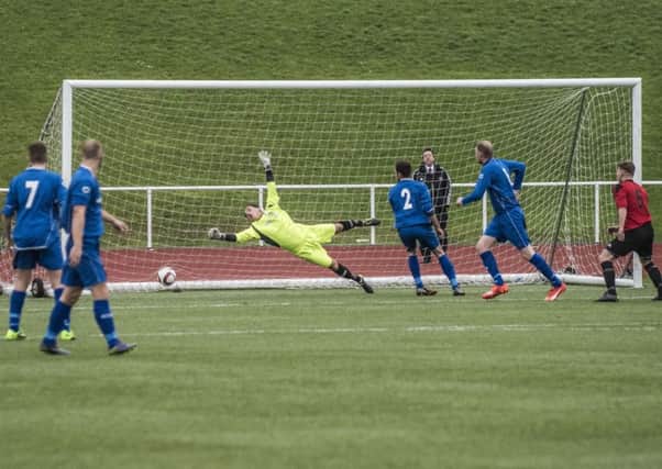 Maryhill's second goal flies past despairing Carluke goalkeeper Jonny Greer