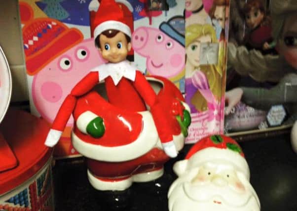 Eli the Elf raids the Christmas cookie jar.
Picture: Sara Furie