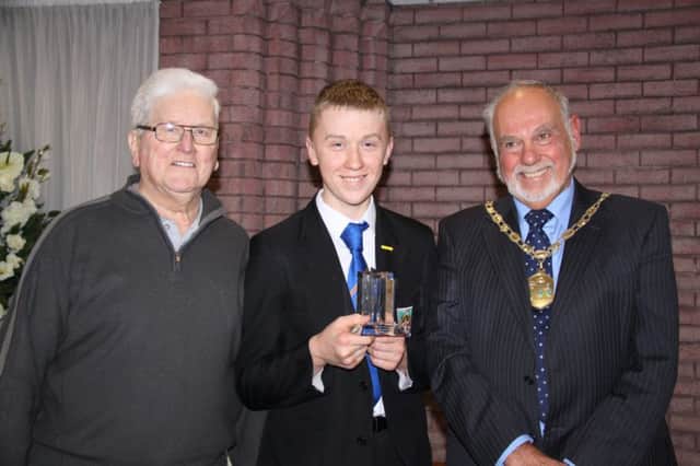 Proud grandad Sandy Malcolm with Andrew as he receives award from the Provost