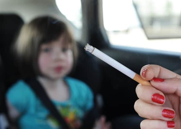 Smoking in cars with children is to become illegal. Images posed by models