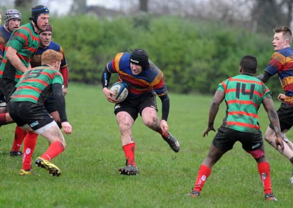 Lenzie's Ali Marshall drives forward at the Oban defence