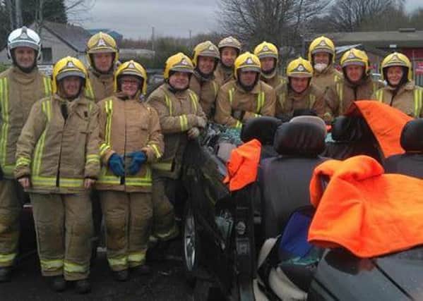 Firefighters from Motherwell Community Fire Station with Betty Fair, Anne Smith and Jean Hodge.