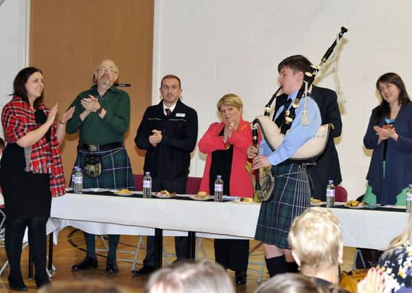 Carluke Primary, Burns day put on by P7's. Mr McCulloch P7 teacher, Gary Wood from the Co-Op, Provist Eileen Logan, Ronnie Boyd and MSP Aileen Campbell, Head Teacher Margo Thomson and piper Ronan Stewart.