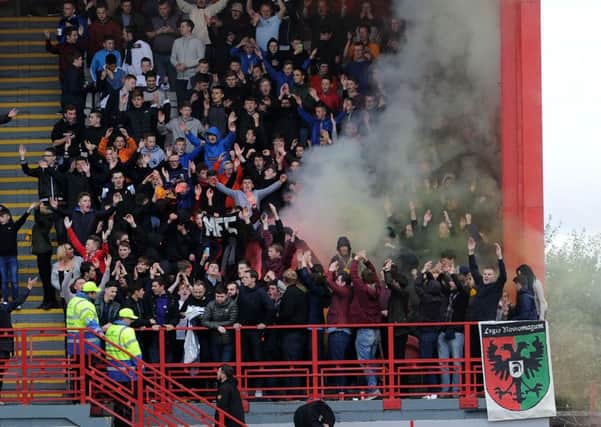 Smoke among the Motherwell fans at New Douglas Park in September.