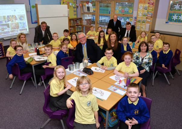 Councillor Logue and headteacher Anita Baskerville are joined by local councillors and the P4 class.