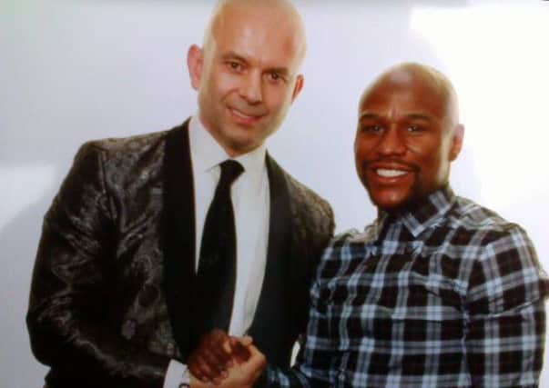 Diarmid Bruce, left, with boxing great Floyd Mayweather.