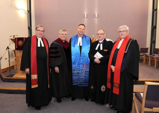 New Motherwell South minister the Rev Alan Gibson (centre) is flanked by (l-r) the Rev Arthur Barrie,  the Rev Gordon McCracken, the Rev Derek Gunn and the Rev John Stevenson as he was inducted into the charge at the opening of the new church santuary.