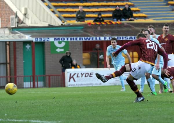 Louis Moult puts Motherwell ahead against Partick Thistle from the penalty spot (Pic by Alan Watson)