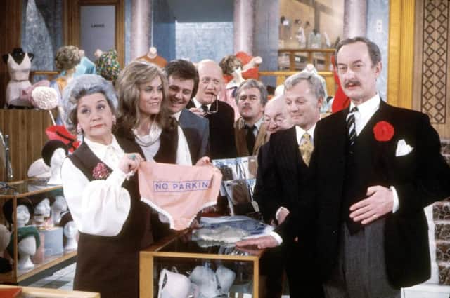 The series 3 cast of Are You Being Served, from 1975, with Mollie Sugden as Mrs Slocombe, Wendy Richard as Miss Brahms, Trevor Bannister as Mr Lucas, Nicholas Smith as Mr Rumbold, Larry Martyn as Mr Mash, Arthur Brough as Mr Grainger, John Inman as Mr Humphreys and Frank Thornton as Captain Peacock.