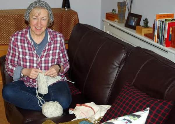 Moira is knitting hats to raise money for research into brain cancer