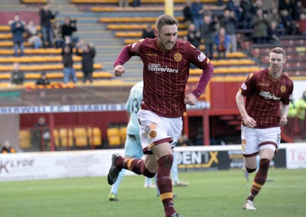 Louis Moult celebrates with Stephen Pearson after putting Motherwell ahead from the penalty spot against Partick Thistle (Pic by Alan Watson)