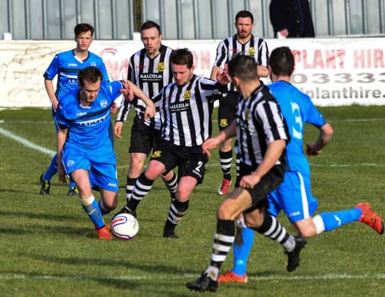 Kilsyth's Paul McBride tries to get the better of a Beith opponent (Pic by Stephen Kerr)