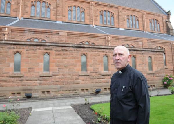 Parish priest Fr Thomas Millar outside Our Lady of Good Aid Cathedral.