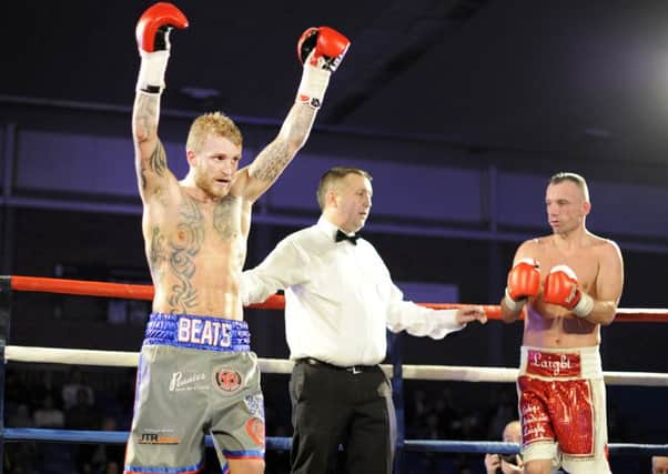 Stevie Beattie celebrates after his opening pro win