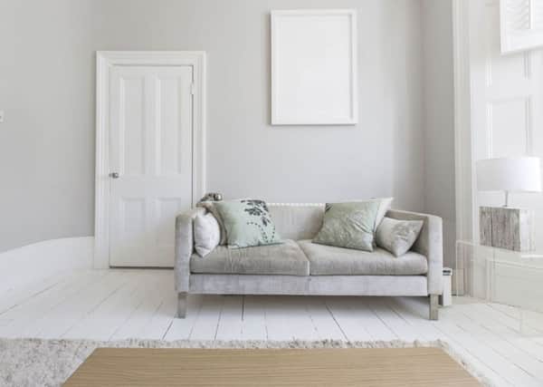 A living room with white painted floorboards. Photo: PA Photo/thinkstockphotos