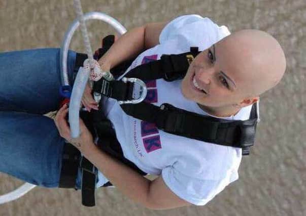 Aimee Young taking part in a charity abseil