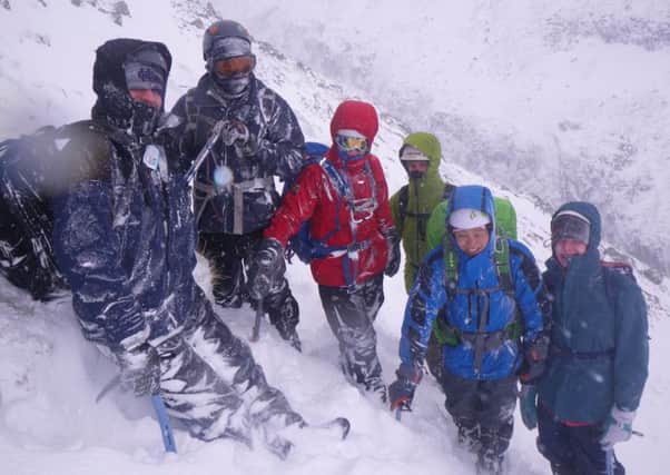 Students enjoying their day of training in the mountains despite the weather.