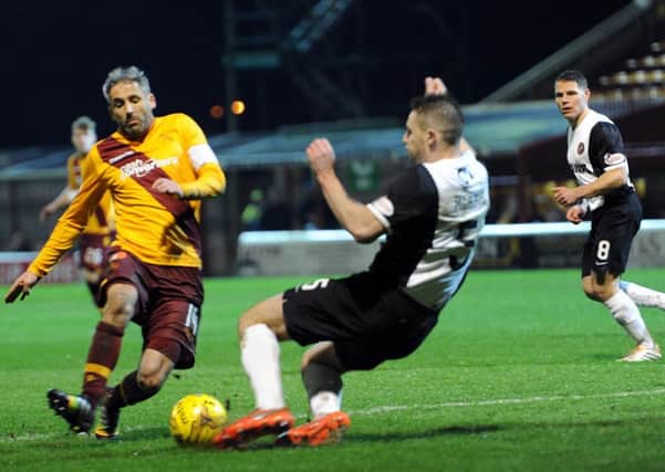 Keith Lasley goes in for challenge with United's Callum Morris which left him injured (Pic by Alan Watson)