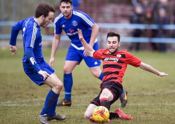 Chris Duff shows his determination to win the ball for Rob Roy