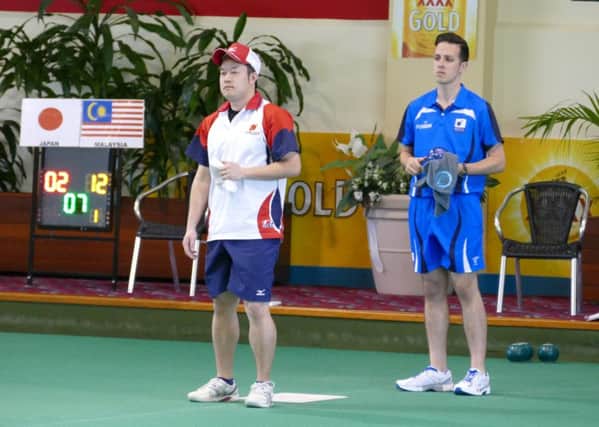 Bowler Gavin Ansari in action at the World Cup against Jun Koyama of Japan (pic by lawnbowls.com)