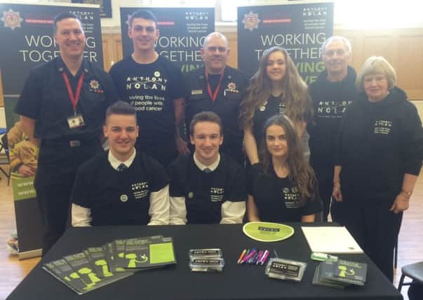 Dalziel students with local Scottish Fire and Rescue officers at the stall.