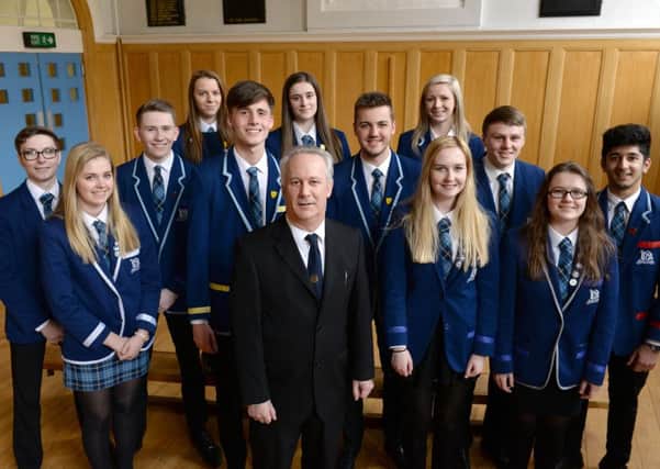 Dalziel High head teacher Robert Birch with some of the pupils who achieved five highers.