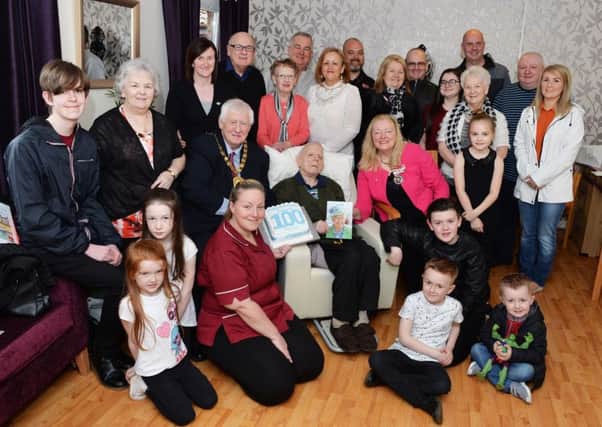 Robert with family, friends, care home staff and North Lanarkshire provost Jim Robertson.