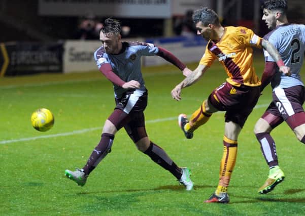 Motherwell's Marvin Johnson scores during the 2-2 Fir Park draw against Hearts earlier this season (Pic by Alan Watson)