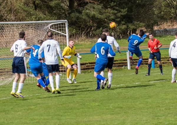 Lanark's Paul Hewitt heads his team in front against Vale of Leven (Pic by Sarah Peters)