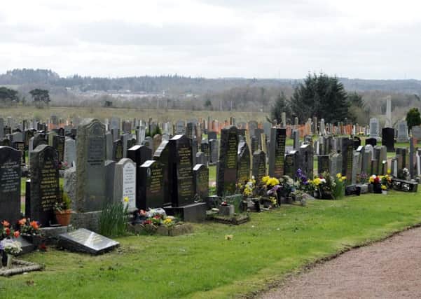 Floral tributes left on graves at Airbles Cemetery have been attracting hungry wildlife