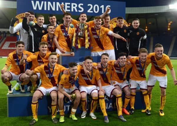 Motherwell under-20s celebrate after winning the Scottish Youth Cup final for the first time in the club's history with a 5-2 success over Hearts at Hampden (Pic by Alan Watson)