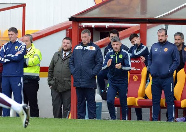 Mark McGhee (centre) praised veterans for their displays in win at Ross County (Pic by Alan Watson)