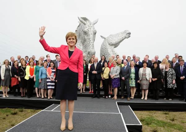 Historic and iconic...First Minister Nicola Sturgeon joined by the SNP's newly elected members of the Scottish Parliament after securing the party's historic third consecutive election victory. (Picture Michael Gillen)