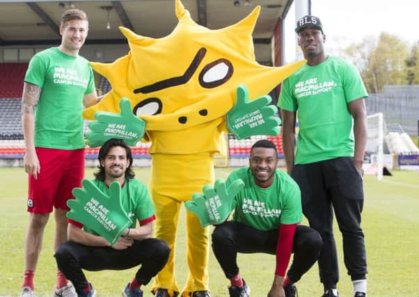 Kingsley with Thistle players Frederic Frans, Ryan Edwards, David Amoo and Mathias Pogba.