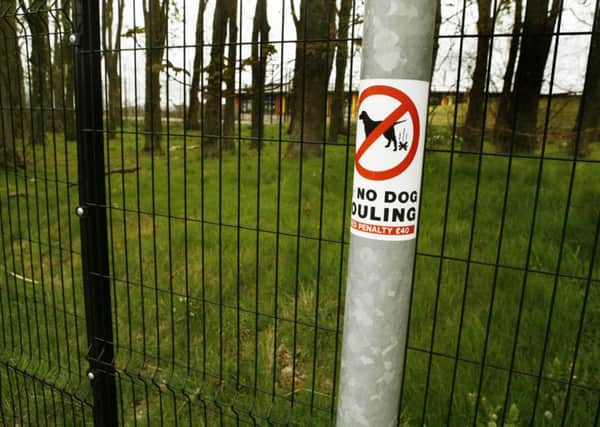 No fouling... but owners are scooping up the poo and throwing it over the fence into woodland at the school.