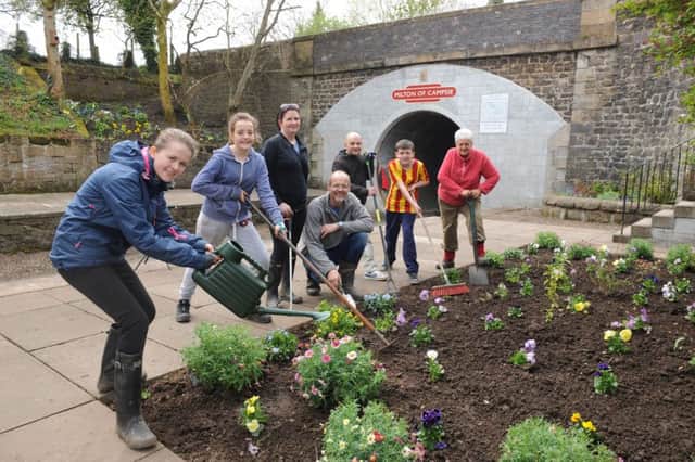 Volunteers get to work at the former Milton of Campsie railway station