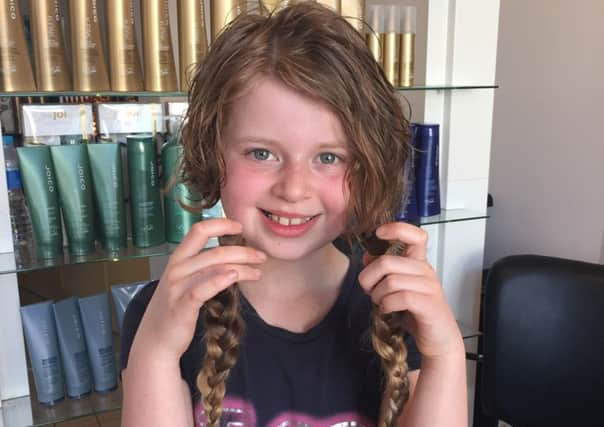 Grace Ewart (10) had her long hair cut off for Little Princess Trust
.