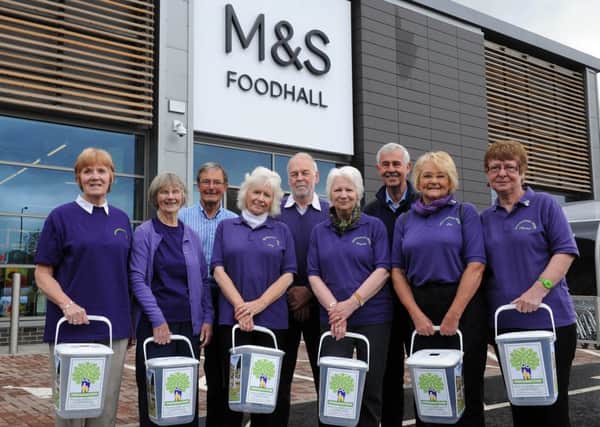 Members of environmental group Uddingston Pride were out collecting at the  store opening.