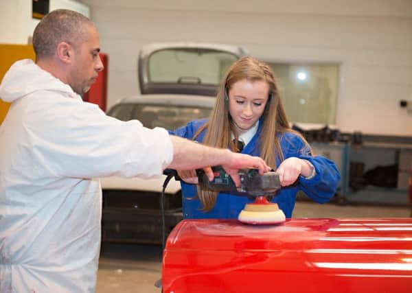 Cathkin High pupil Megan Russell gets hands on experience from LAGTA's Steven Leitch.