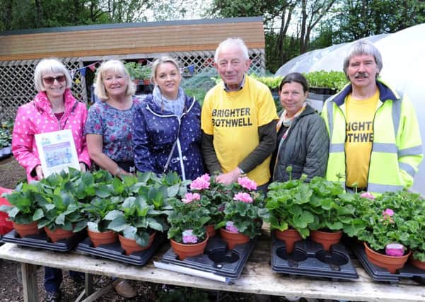 Growers show off their plants at open day.