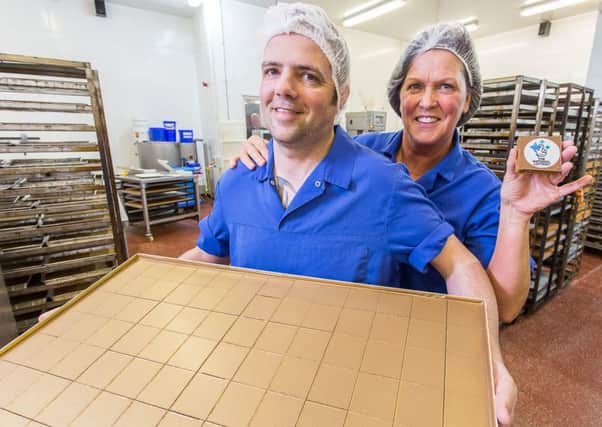 Kerrs Bakery workers Stuart Wands and Liz Neilson show off the luxury version of the millionarie's shortbread.