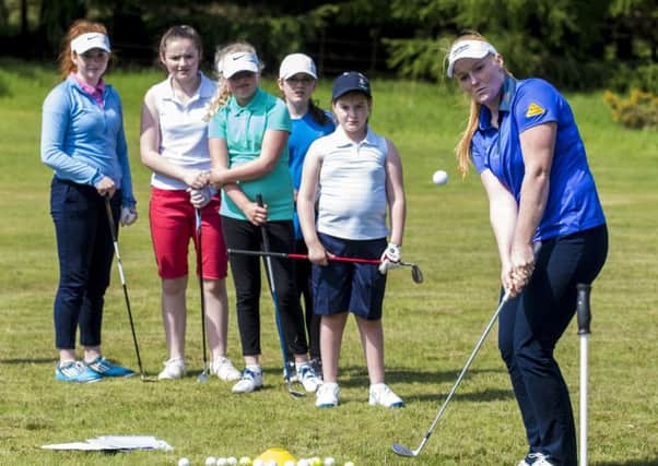 Young hopefuls look on as Kylie demonstrates her skills (pic courtesy of Craig Watson)