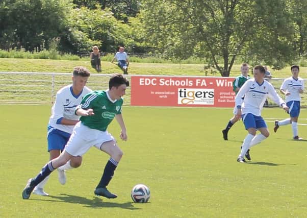 Lenzie Academy's Greg Burns has Bishopbriggs Academy's Jonny Scott in close attendance during the East Dunbartonshire Schools U18s Cup Final at Murray Park