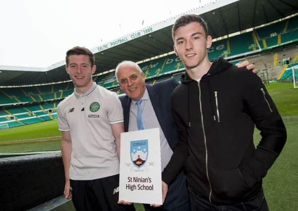 St Ninians headteacher Paul McLaughlin with former pupils Anthony Ralston (left) and Kieran Tierney.